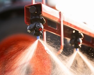 nozzle on farm machinery spraying liquid